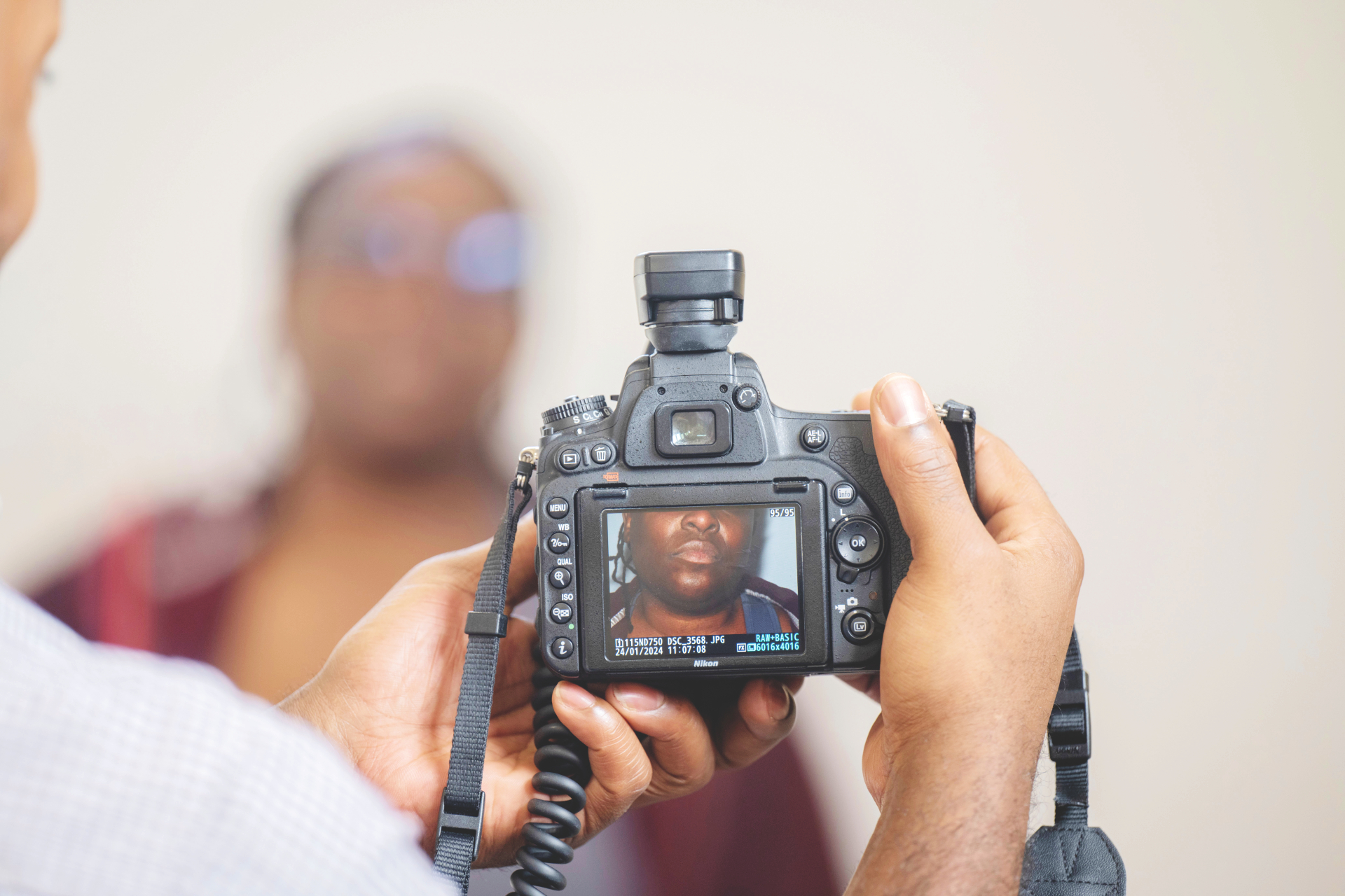 A photo of a volunteer taking part in a photoshoot for the Reframe project